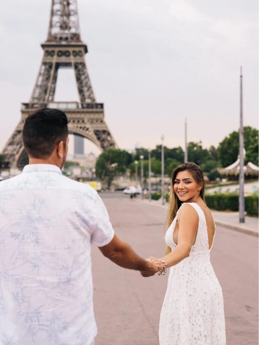 Surprise proposal photography at Eiffel Tower Paris, bride in white dress, engagement session