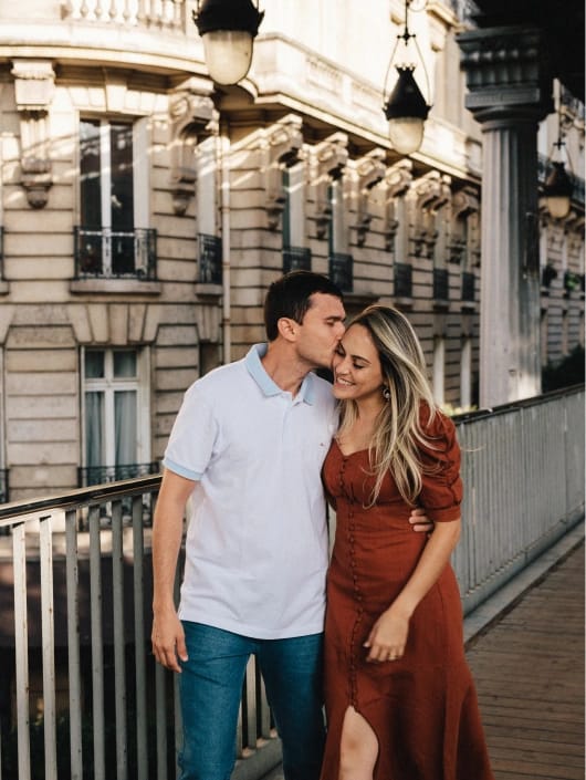 Couple portrait session in classic Parisian architecture, golden hour lifestyle photography