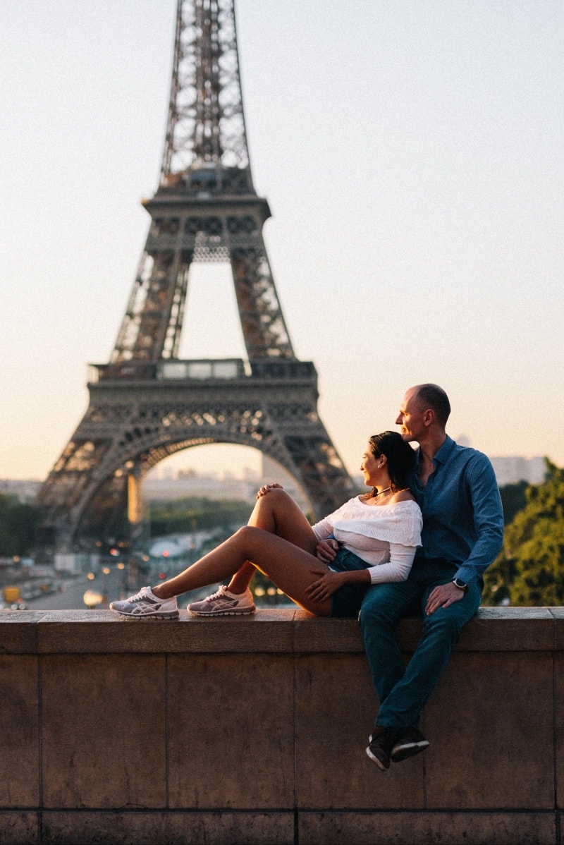 Couple kissing in Paris in front of the Eiffel Tower 1