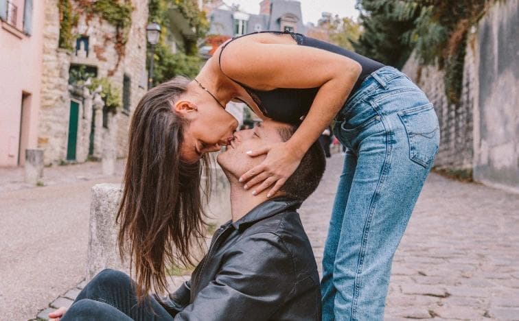 Romantic winter couple photoshoot at Trocadero, Eiffel Tower Paris kiss portrait in the rain